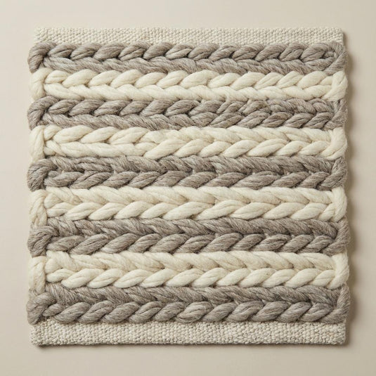 Translation missing: es.Textured neutral wool rug with oversized braided pattern, perfect for modern minimalist and rustic interior décor