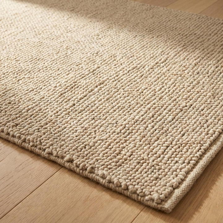 Translation missing: es.Close-up of handwoven wool rug showing chunky loop texture and neutral tone for cozy living room styling