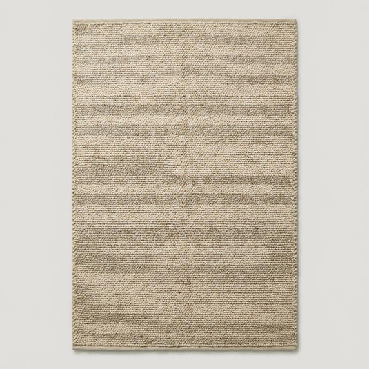 Translation missing: es.Natural beige wool area rug with deep woven loops, ideal for Scandinavian or boho interior design