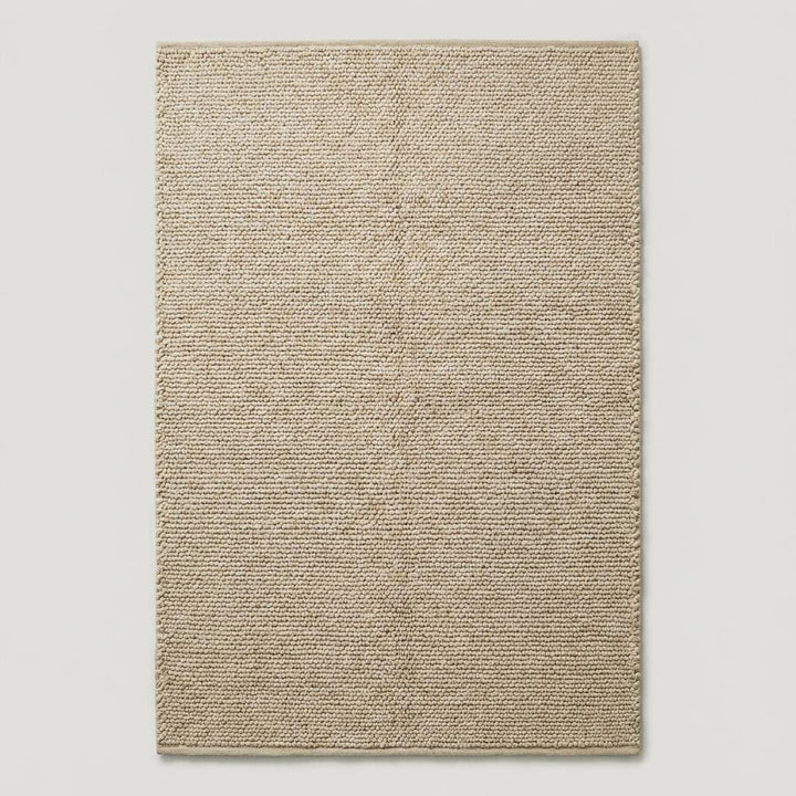 Translation missing: es.Natural beige wool area rug with deep woven loops, ideal for Scandinavian or boho interior design