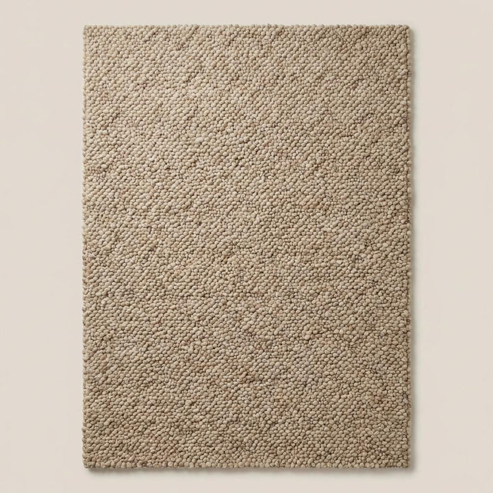 Translation missing: es.Handwoven chunky wool area rug in soft beige tone, natural wool carpet for farmhouse and modern interiors