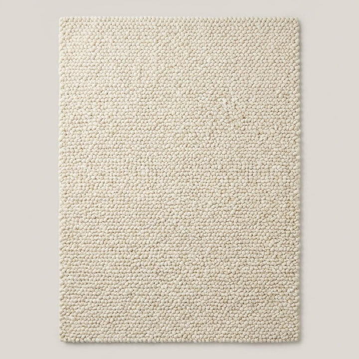 Translation missing: es.Chunky wool rug with thick loop texture in neutral cream, handwoven natural wool area rug for cozy minimalist home décor