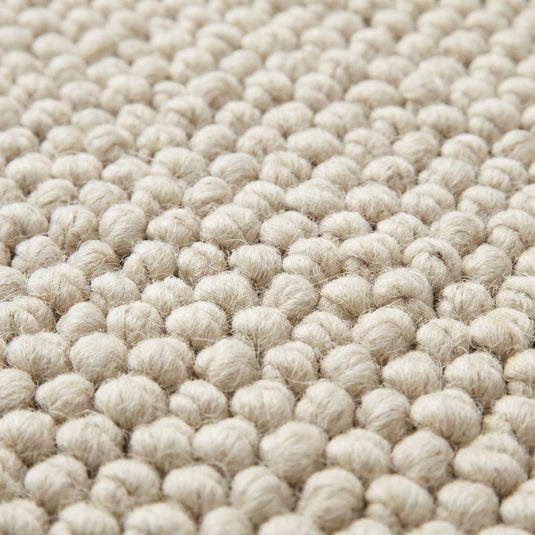 Translation missing: es.Handwoven wool area rug featuring looped textured design, plush chunky wool for minimalist living room décor