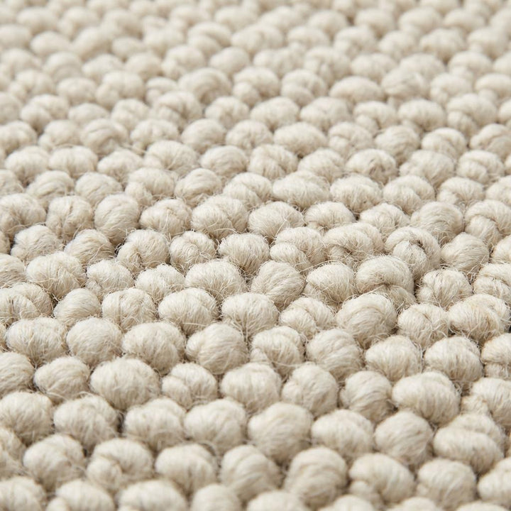 Translation missing: es.Handwoven wool area rug featuring looped textured design, plush chunky wool for minimalist living room décor