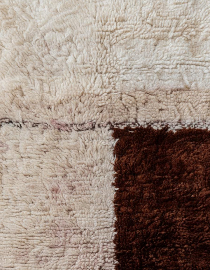 Translation missing: es.Plush handwoven wool rug styled in minimal studio: cream field, chocolate block motif, peach and mint accents, fringe included — rugs rug carpet teppich