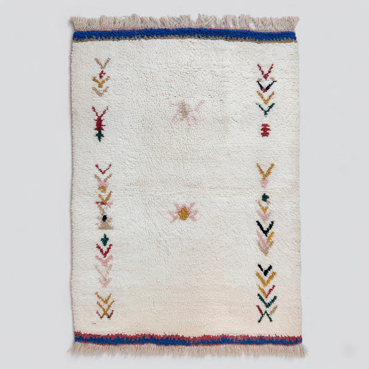 Translation missing: es.Handwoven Moroccan wool rug with cream Berber tribal motifs for boho home decor