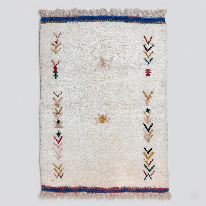 Translation missing: es.Handwoven Moroccan wool rug with cream Berber tribal motifs for boho home decor