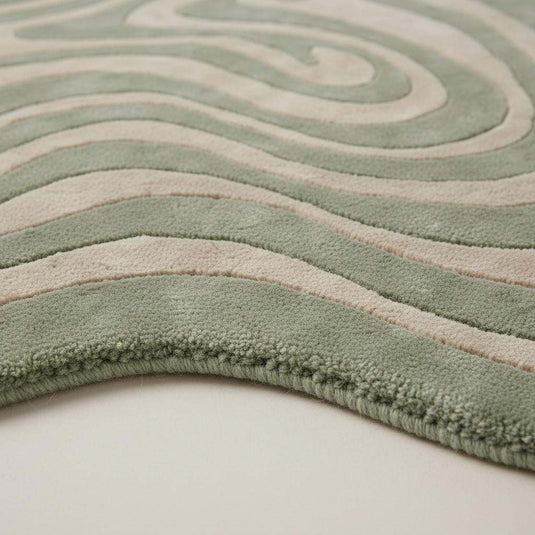 Translation missing: es.Close-up of hand tufted rug showing plush high pile texture, soft fibers, and dense craftsmanship