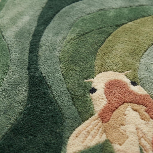 Translation missing: es.Close-up of hand-tufted koi fish rug showing plush fibers, carved texture, raised koi details, and high-quality craftsmanship with soft green and cream tones