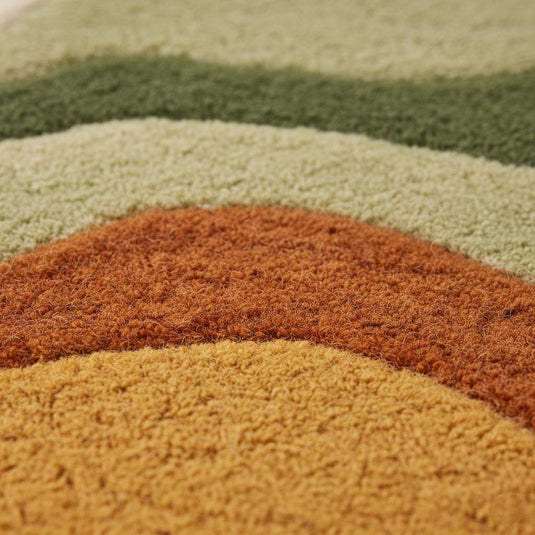Translation missing: es.Close-up of plush tufted pile and abstract wave pattern on boho shag rug, ideal living room accent