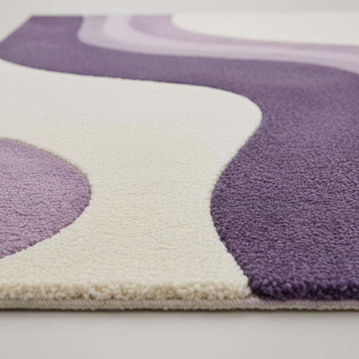 Translation missing: es.Lavender area rug with modern retro curvy stripe pattern and plush tufted surface in pastel purple and cream colors
