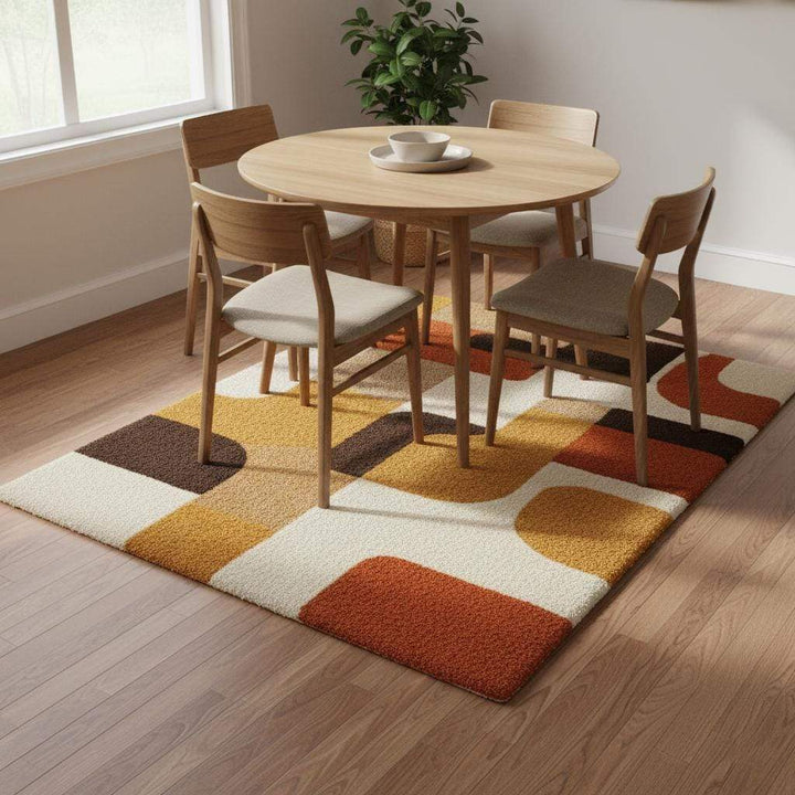 Translation missing: en.Mid century modern rug with retro geometric pattern in warm orange, yellow, brown, and cream tones, soft tufted texture, and durable construction