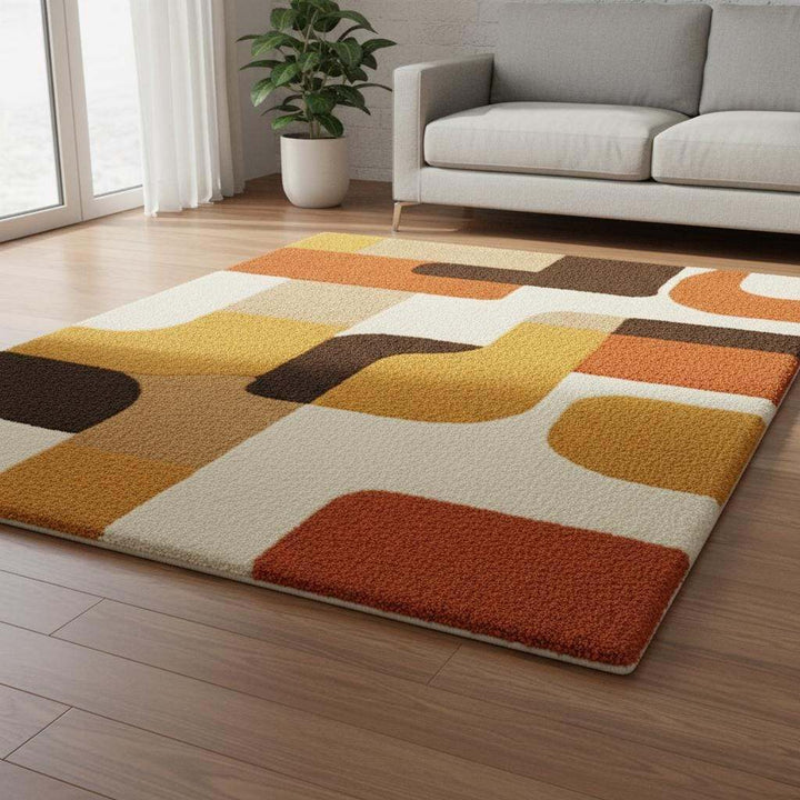 Translation missing: en.Mid century modern rug with retro geometric design in orange, yellow, brown, and cream tones, soft tufted texture, and durable construction