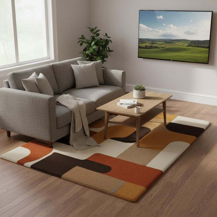 Translation missing: en.Mid century modern rug with geometric retro design in warm orange, yellow, brown, and cream tones, soft tufted texture, and durable construction