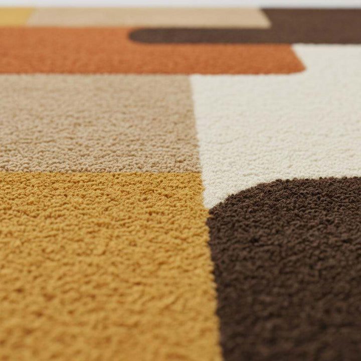 Translation missing: en.Mid century modern rug with retro geometric design in warm orange, yellow, and brown tones, soft tufted texture, and durable handmade construction