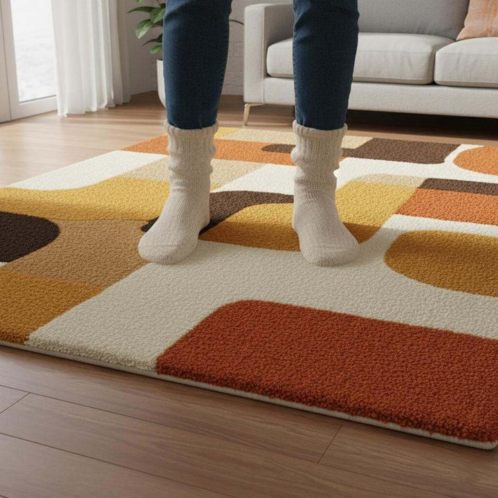 Translation missing: en.Mid century modern rug with geometric retro design in orange and yellow tones, soft tufted texture and durable construction