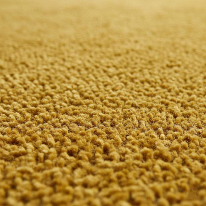 Translation missing: es.Mustard yellow area rug with mid-century modern low pile design for living room decor