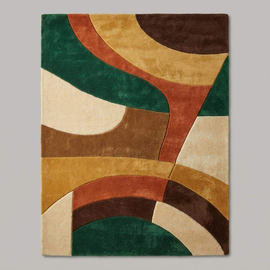 Translation missing: es.Retro abstract area rug placed in a mid century modern living room, adding warmth and bold color to the seating area