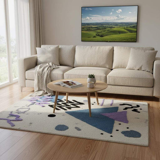 Translation missing: es.Abstract geometric rug with pastel blue and lavender shapes on ivory base, soft bouclé texture, modern Memphis style area rug for living rooms and nurseries