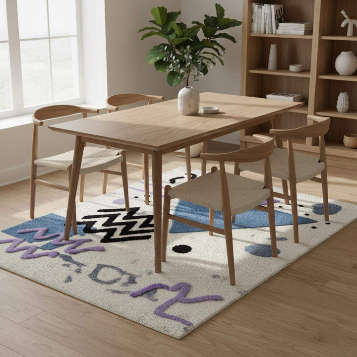 Translation missing: es.Abstract geometric rug with pastel blue and lavender shapes on a soft bouclé textured ivory base