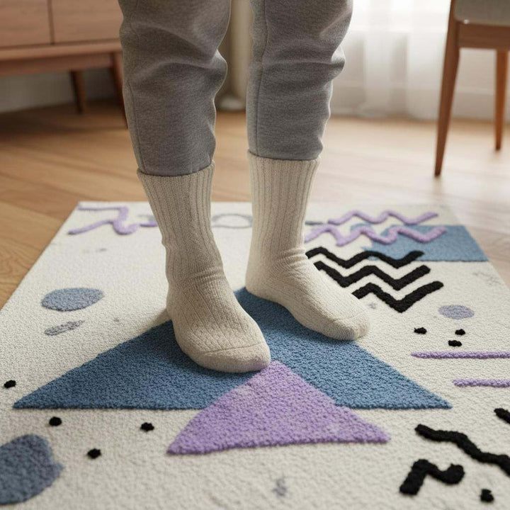 Translation missing: es.Abstract geometric rug with pastel blue and lavender shapes on ivory bouclé texture