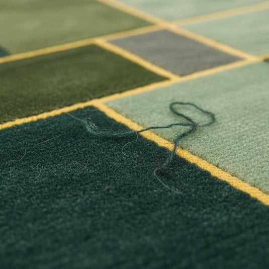 Translation missing: es.Modern geometric rug with abstract green, sage, and mustard wool design