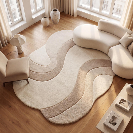 Translation missing: es.Handmade modern abstract wool rug in ivory and beige tones styled in a minimalist living room with curved cream sofa and warm wood flooring __etsy:8000518650