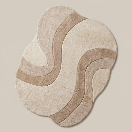 Translation missing: es.Organic contemporary area rug with sculpted abstract design placed beneath modern curved sectional sofa in a Japandi-inspired interior __etsy:8000518502