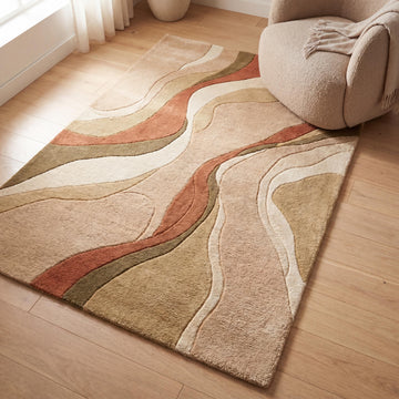 Translation missing: es.Handmade modern abstract wool blend rug in beige and terracotta tones styled in a warm contemporary living room with organic curved patterns __etsy:8042235233