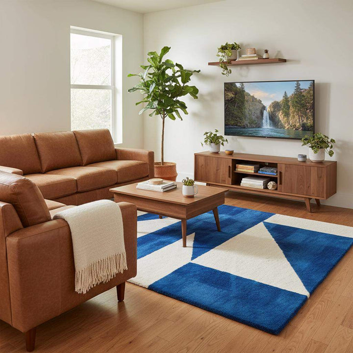 Translation missing: en.Mid-century inspired blue and cream geometric rug adding contrast and texture to a minimalist home setting