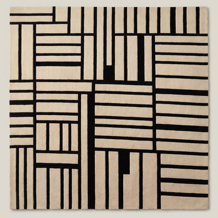 Translation missing: es.Contemporary black and cream geometric wool area rug placed under accent chair in modern minimalist living room