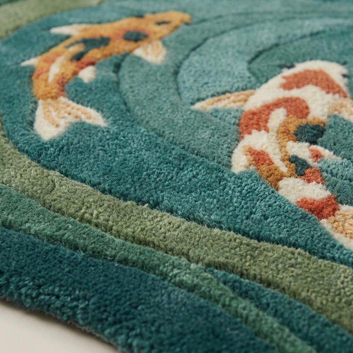 Translation missing: es.Close-up of dense wool hand-tufted pile showing sculpted carved texture and soft fiber surface in teal and sage tones