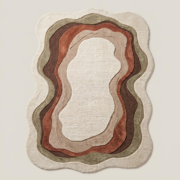 Translation missing: es.Contemporary abstract area rug styled beside accent chair in warm minimalist interior with soft sculpted organic edges __etsy:7994270250