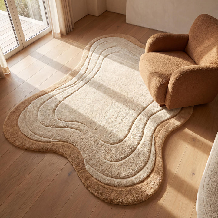 Translation missing: es.Handmade organic shape wool rug in beige and cream tones styled in a modern minimalist living room with warm natural lighting __etsy:8026404736