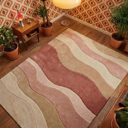 Translation missing: es.Blush-pink modern wave pattern rug with cream-beige tones in cozy living room setting