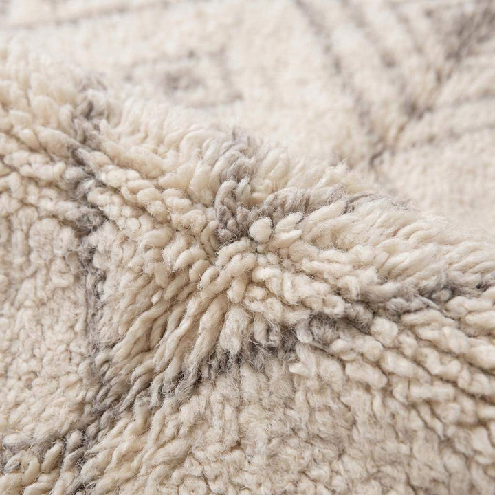Translation missing: es.Close-up of textured New Zealand wool pile with diamond pattern