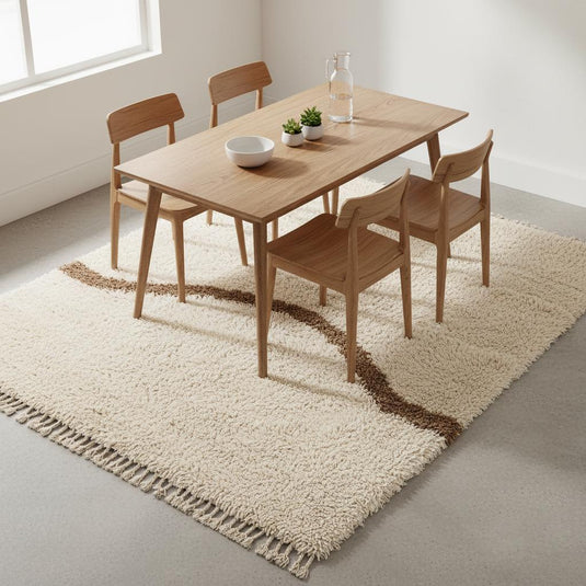 Translation missing: es.Soft neutral Moroccan shag rug featuring a taupe curved line across the top, styled for modern minimalist décor