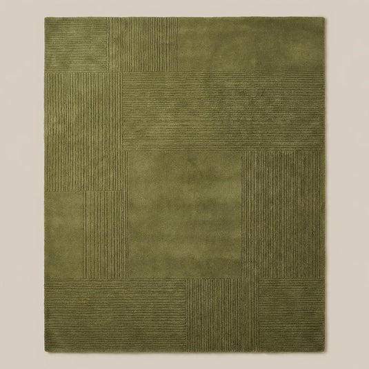 Translation missing: es.Top down view of olive green geometric patchwork rug displaying full square panel layout and textured detailing