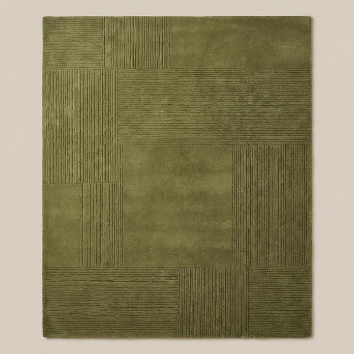 Translation missing: en.Top down view of olive green geometric patchwork rug displaying full square panel layout and textured detailing