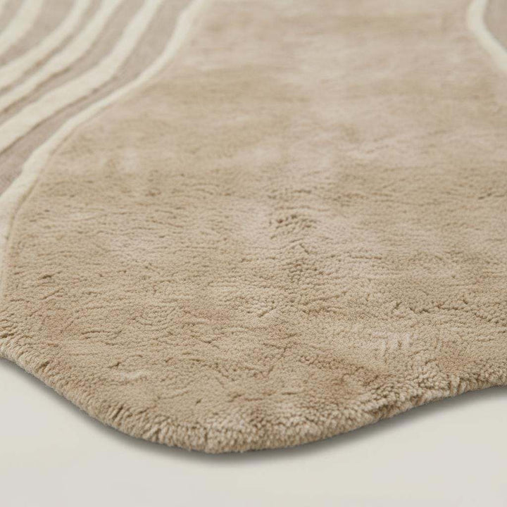 Translation missing: en.Hand-tufted organic wavy rug in beige with irregular shape and soft plush texture for modern minimalist decor