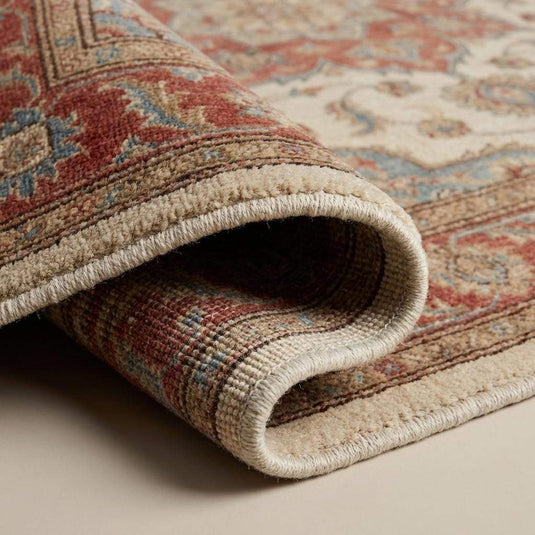 Translation missing: es.Close-up of hand knotted wool rug showing individual knot structure, dense wool fibers, low pile texture, and traditional knot-by-knot craftsmanship