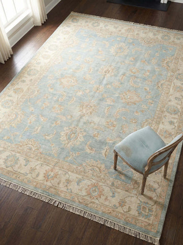 Translation missing: es.Oushak hand knotted wool area rug with soft blue floral design and natural wool texture
