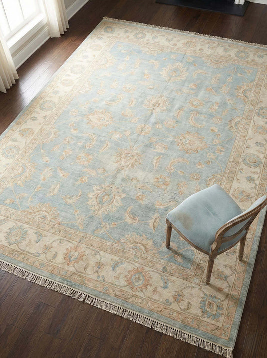 Translation missing: es.Oushak hand knotted wool area rug with soft blue floral design and natural wool texture