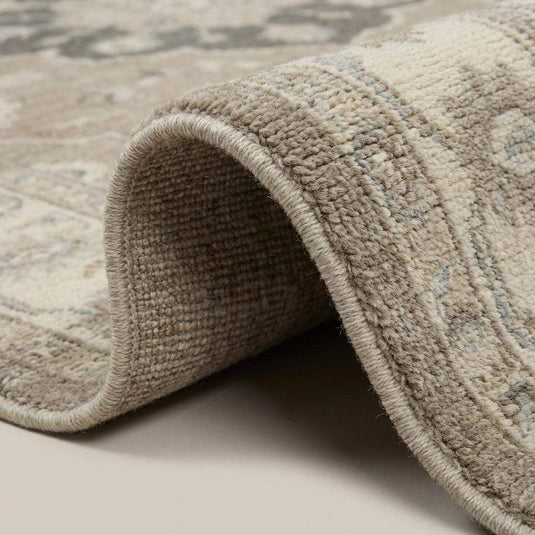 Translation missing: en.Close-up of hand knotted wool rug showing dense pile, visible knot structure, and natural wool texture
