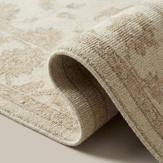 Translation missing: en.Close-up of hand knotted wool pile showing dense knots, natural fibers, and soft texture