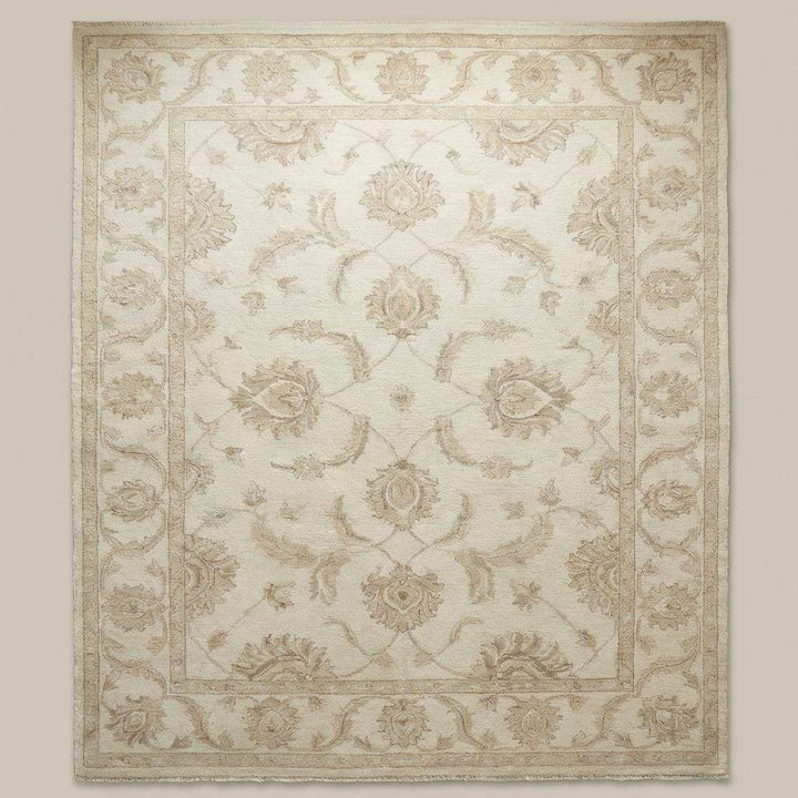 Translation missing: en.Neutral floral wool rug styled in bright living room with wooden flooring