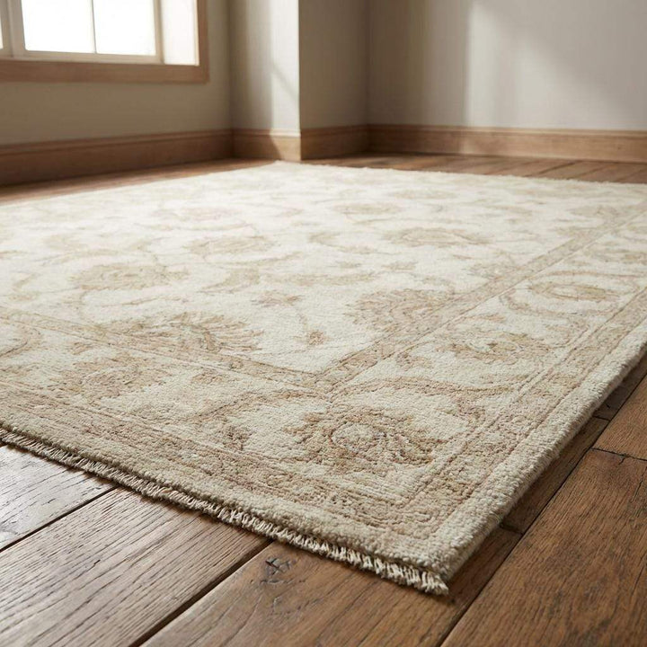Translation missing: en.Ivory and beige hand knotted wool rug with elegant border detailing