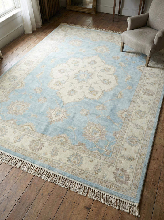 Translation missing: en.Hand knotted Oushak wool area rug in soft blue with traditional floral medallion design