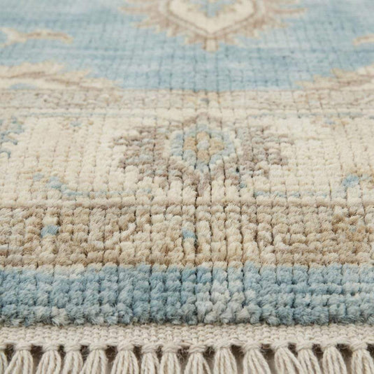 Translation missing: en.Close up of hand knotted wool pile showing dense knots, natural fibers, and soft texture
