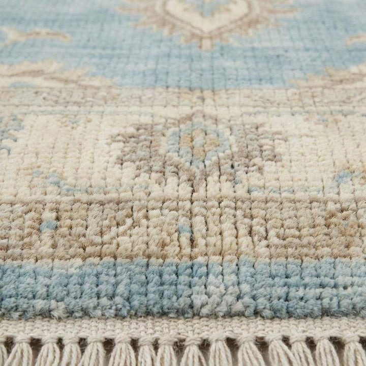 Translation missing: en.Close up of hand knotted wool pile showing dense knots, natural fibers, and soft texture